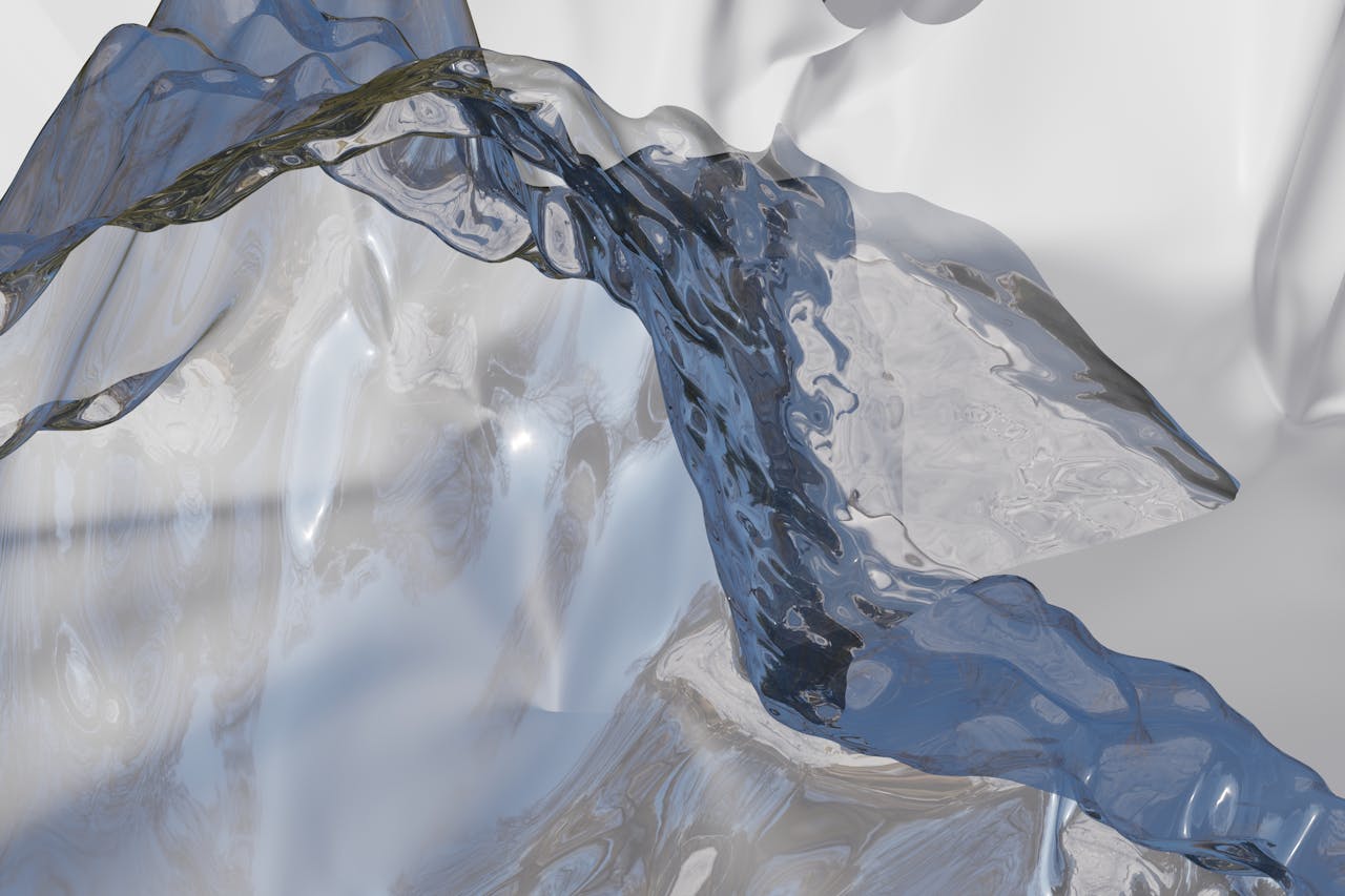 Dynamic abstract image featuring fluid motion and transparent waves in a cool color palette.